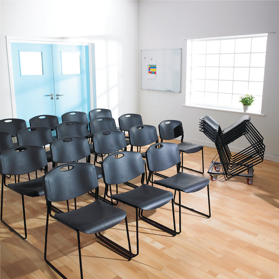 Monza Stacking and Linking Chair Black in Rows and Stacked on Trolley Lifestyle Image