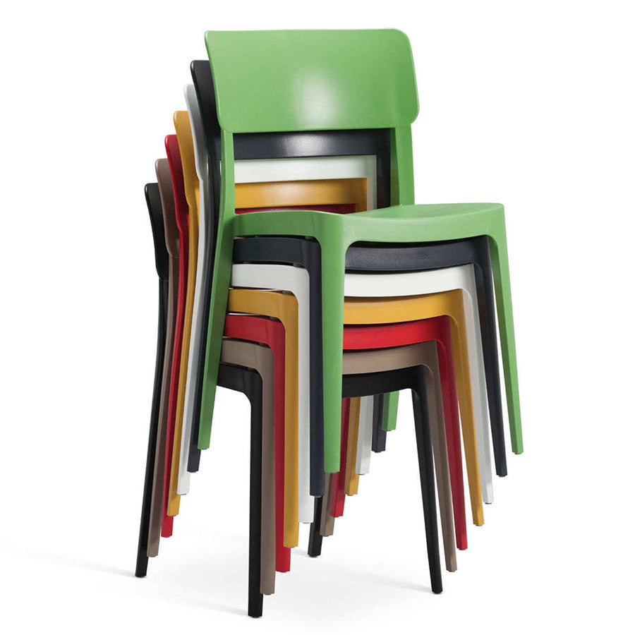 Stack of colorful chairs on a white background